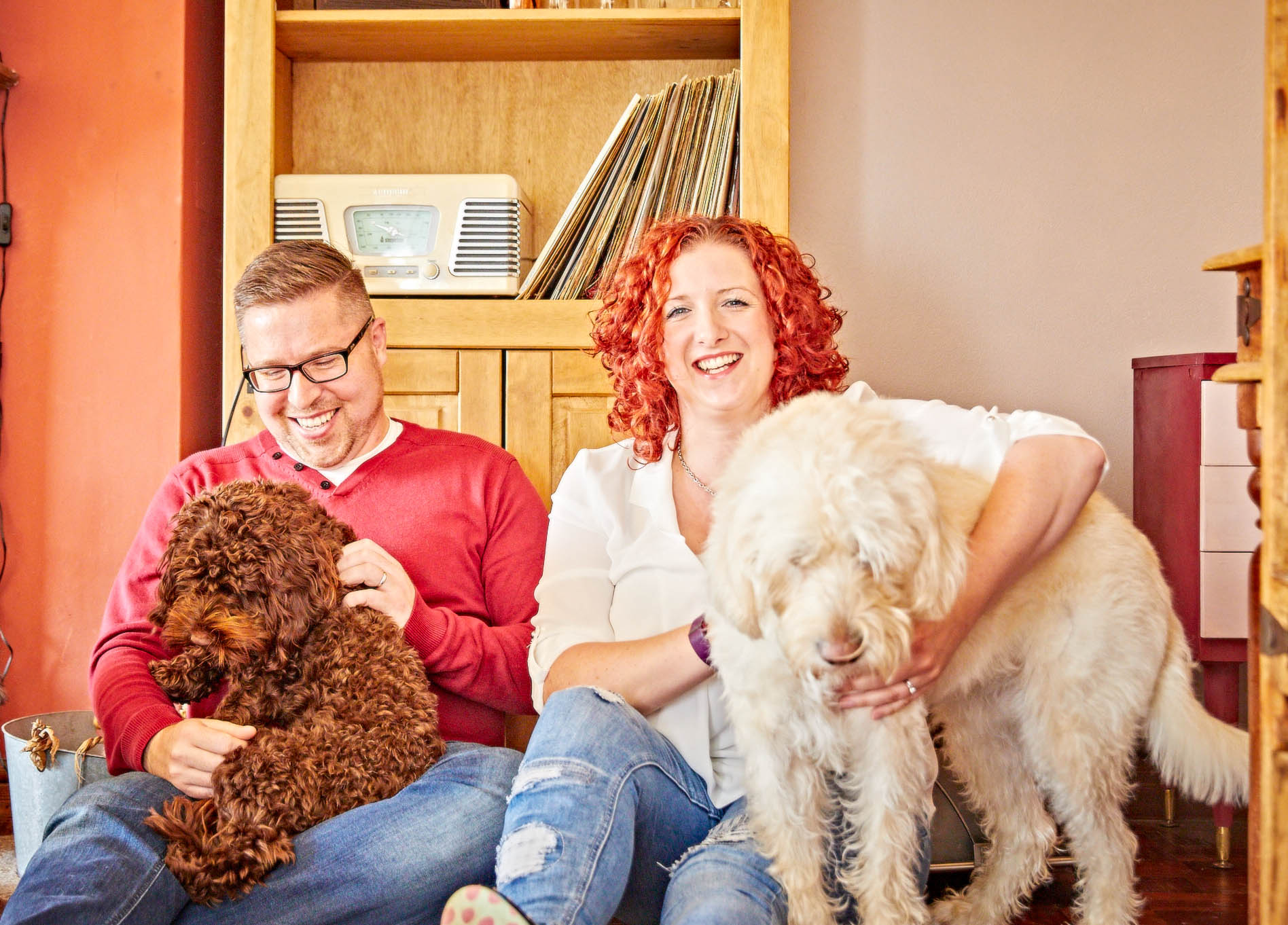 Katie with her husband and their two dogs at home